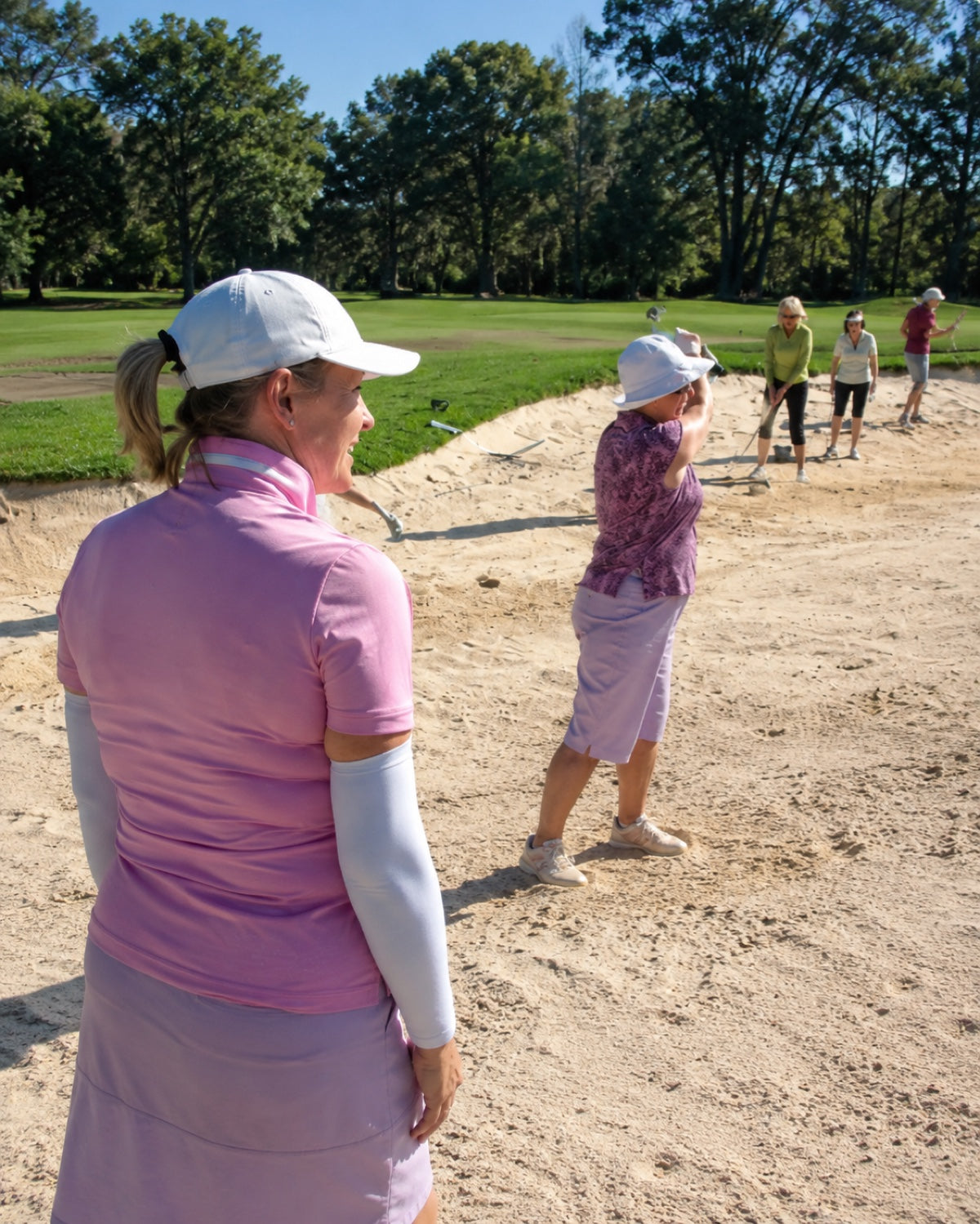 Anne coaching a student on the tee box
